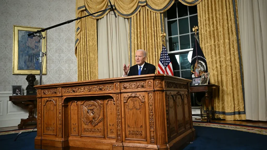 President Biden giving a speech from behind a desk